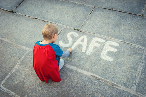 Little boy with inscription 'safe'